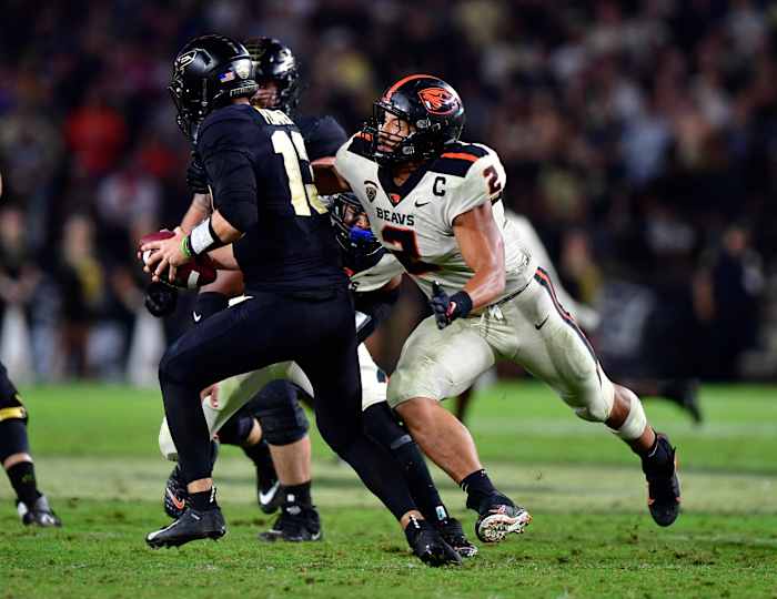 Oregon State linebacker Andrzej Hughes-Murray (2) sacks Purdue quarterback Aidan O'Connell (13).